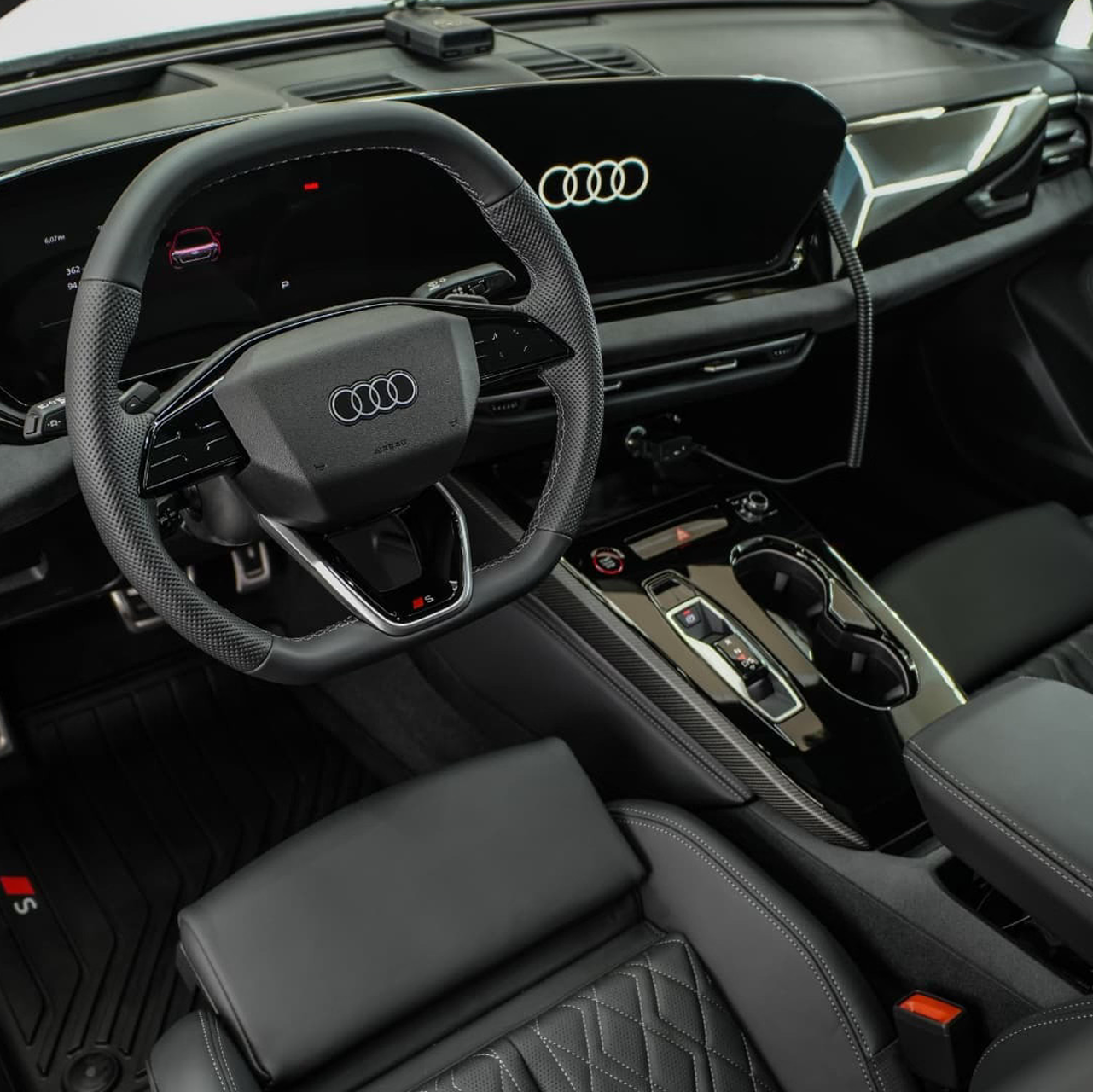 Car detailer wiping the headlight of a car